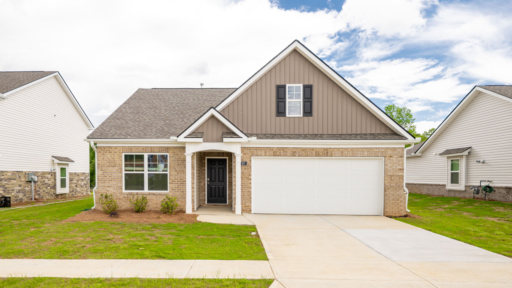 One story home with two car garage and brick