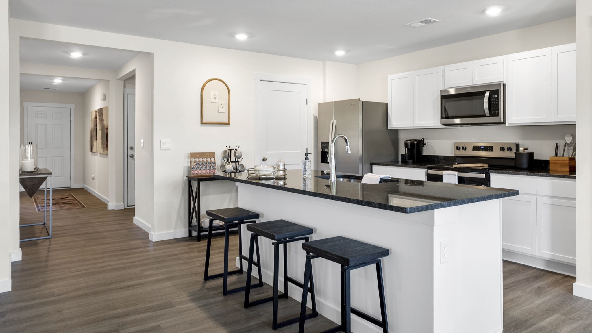 open concept kitchen with large island and stainless steel appliances