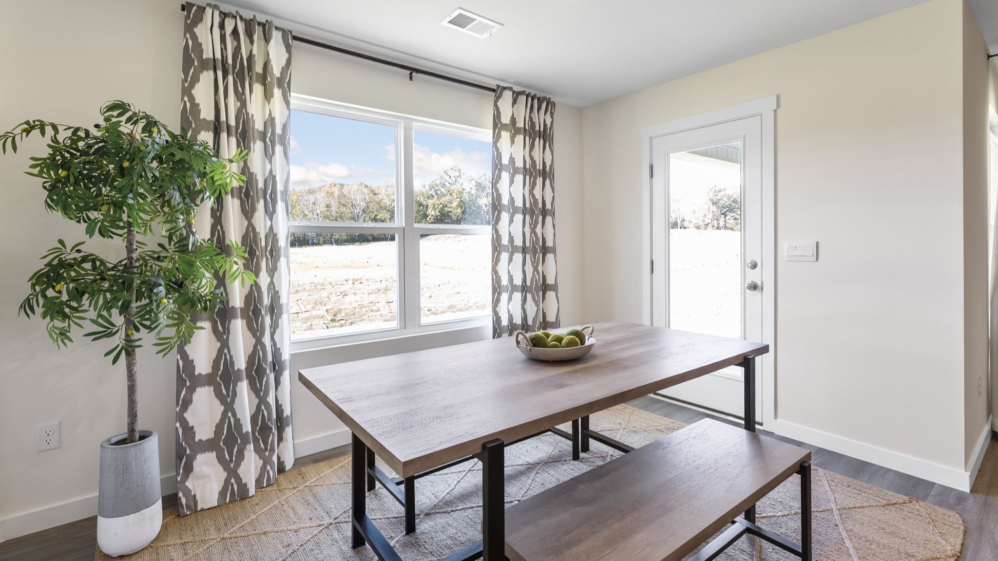 dining area with double window and back patio door