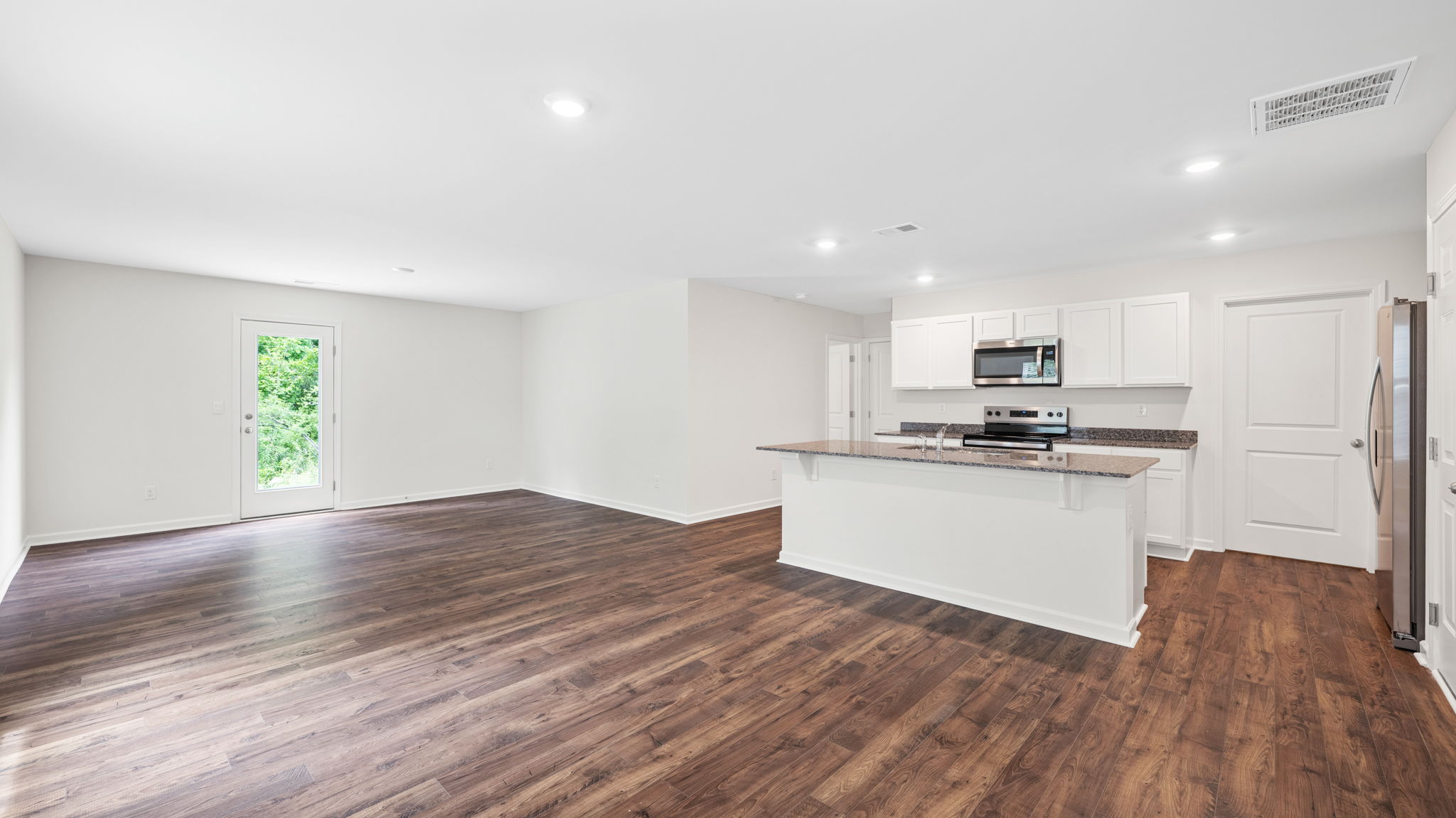 open living area is adjacent to kitchen