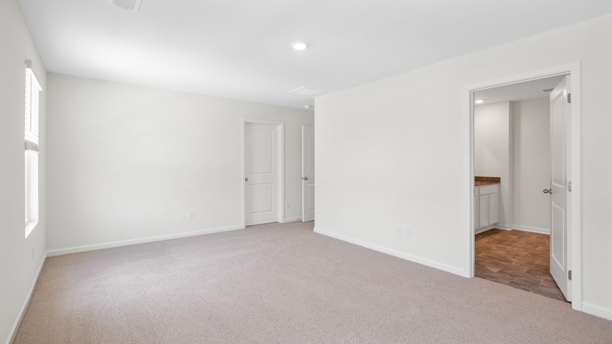primary bedroom with bathroom