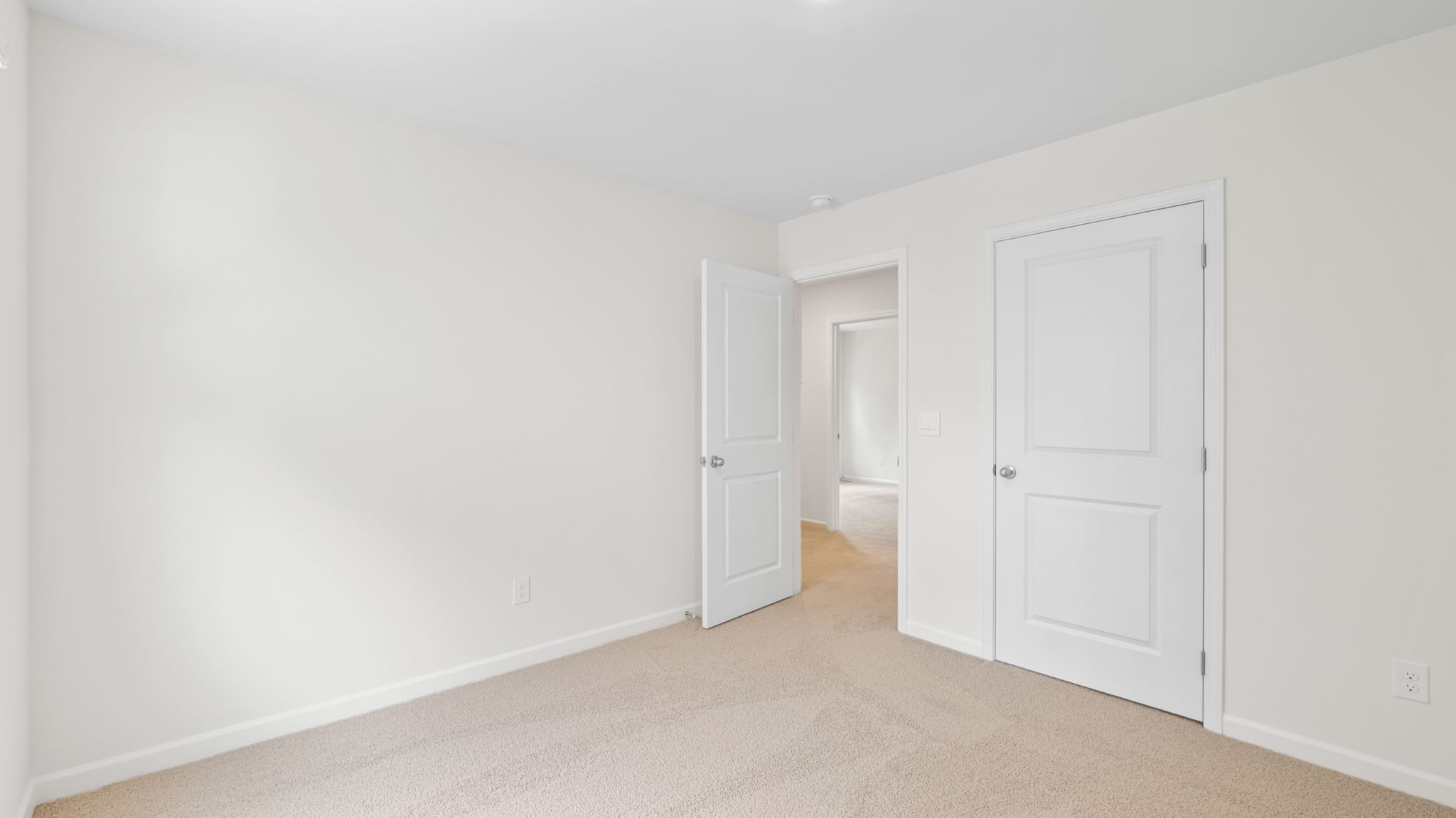 bedroom leading to open door