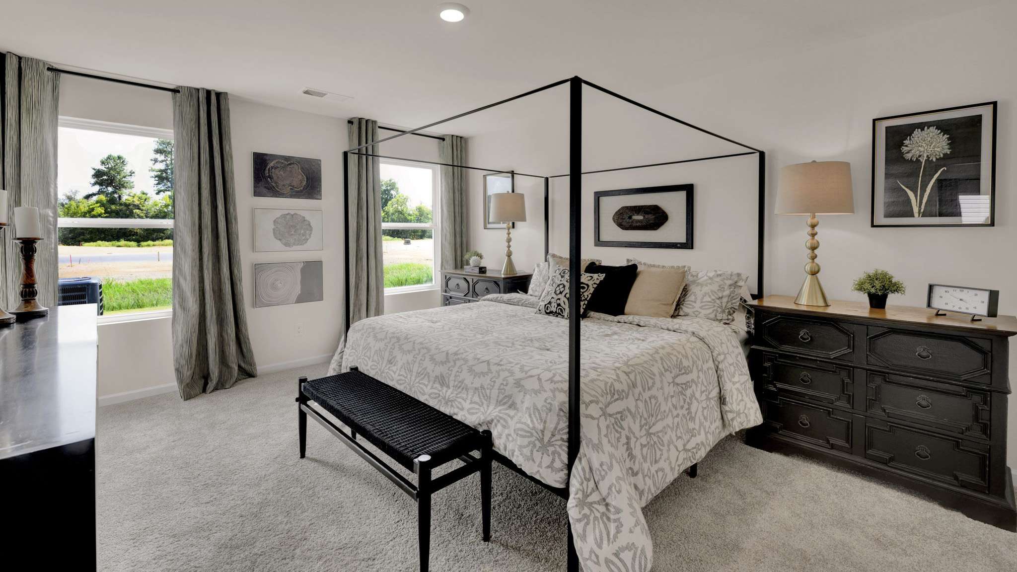 Primary bedroom with carpet on second floor