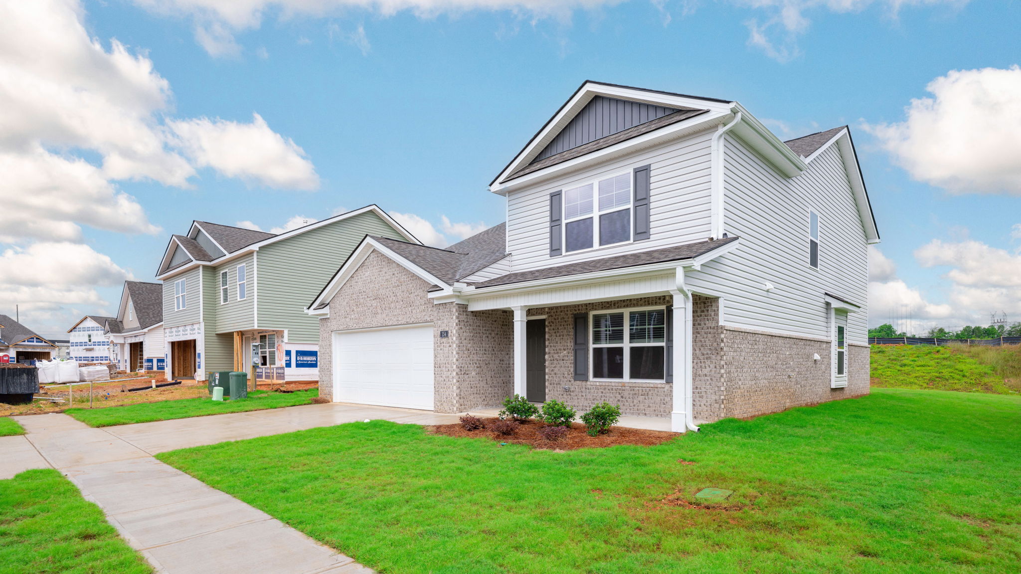 Exterior of two story home with garage and driveway.