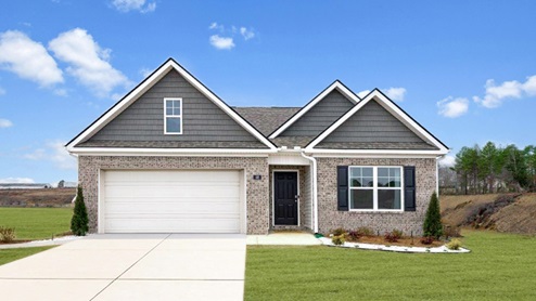 Exterior of one story home with brick and two car garage