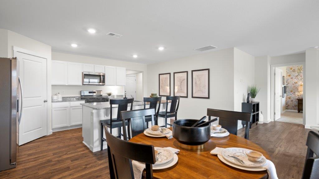 the breakfast area is adjacent to the kitchen
