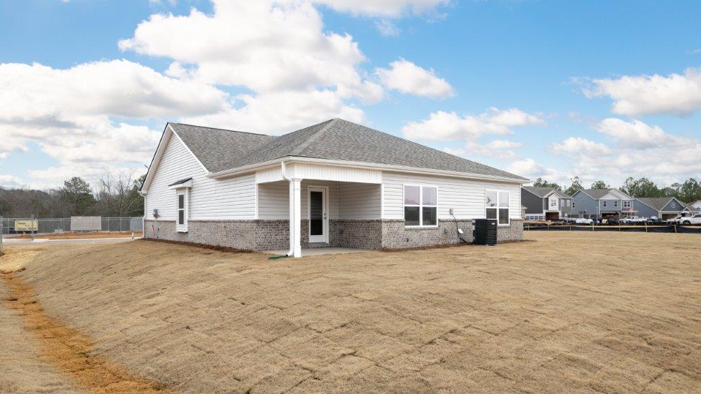 exterior of single story home with large yard