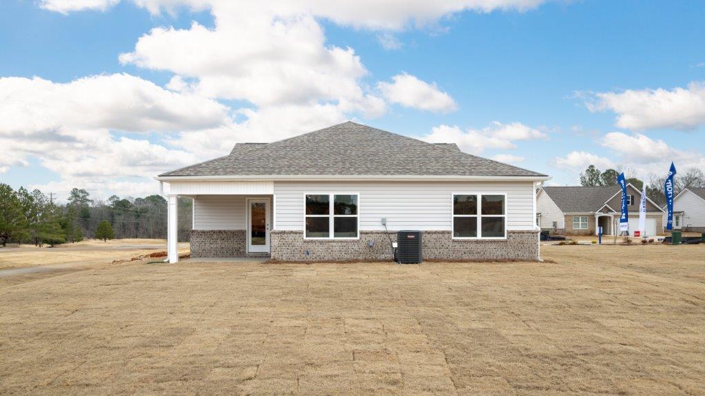 exterior of home with patio and large yard