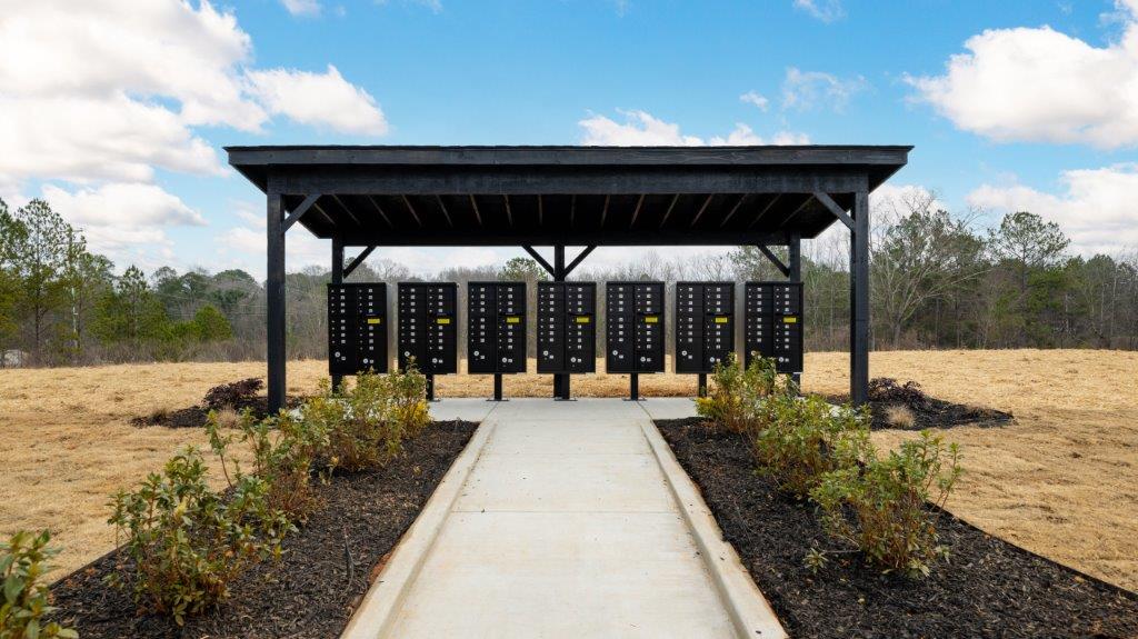 mailbox area with surrounding green space