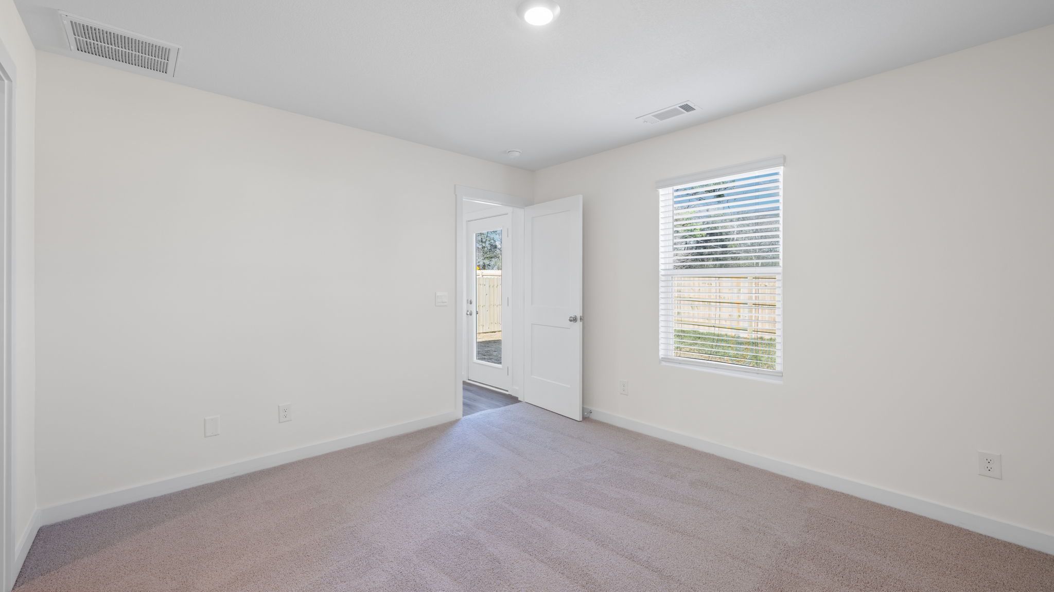 bedroom with lvp flooring and window