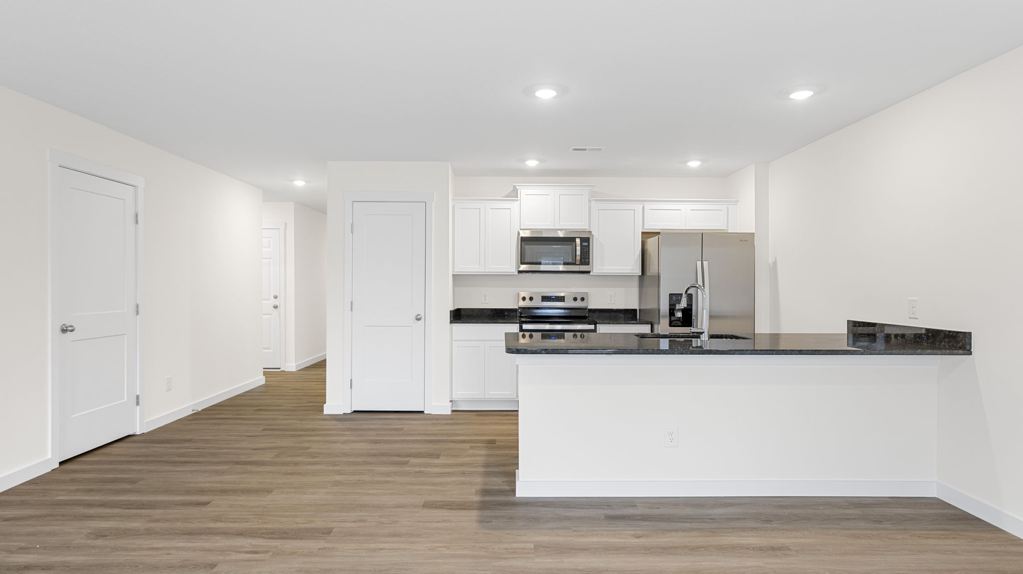 open concept kitchen with walk-in pantry