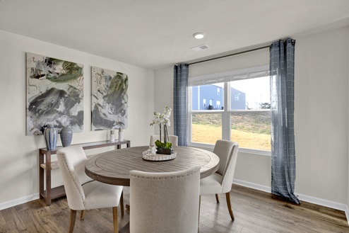 Dining area off kitchen with double window