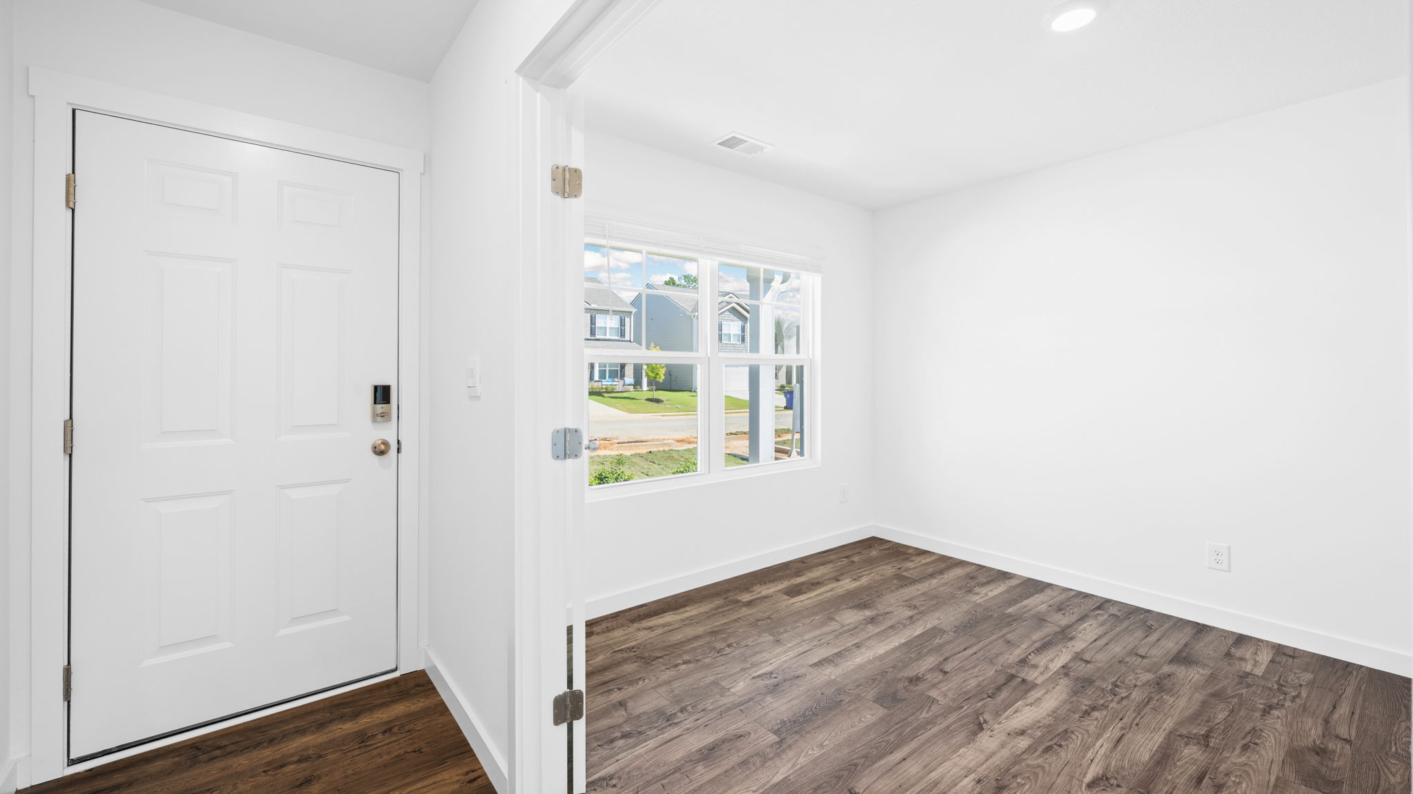 Front door view into the foyer with direct access to the flex study office and main living spaces Crescent Ridge