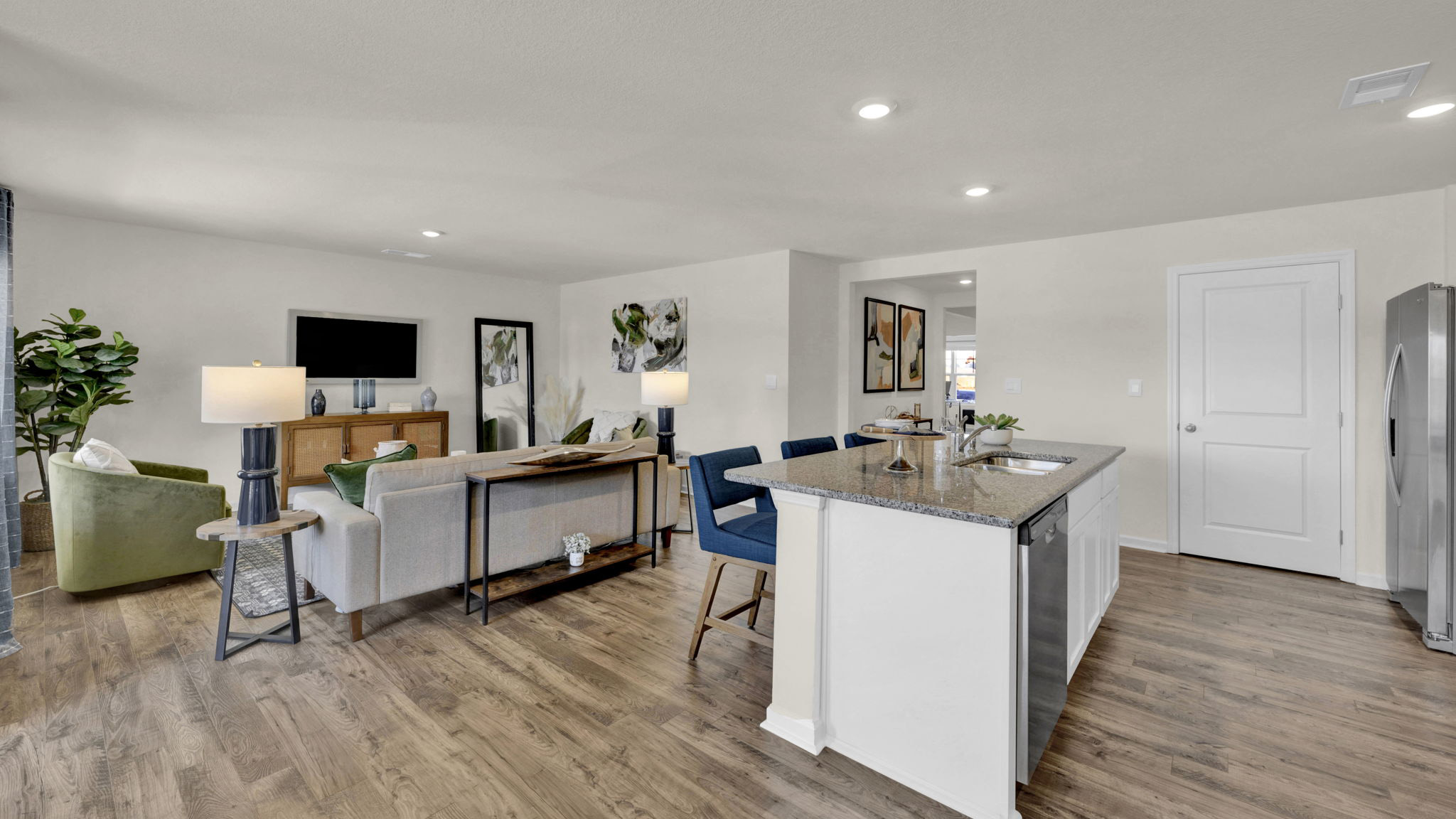 kitchen with island opens into the living room
