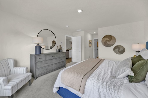 Primary bedroom with carpet and ensuite