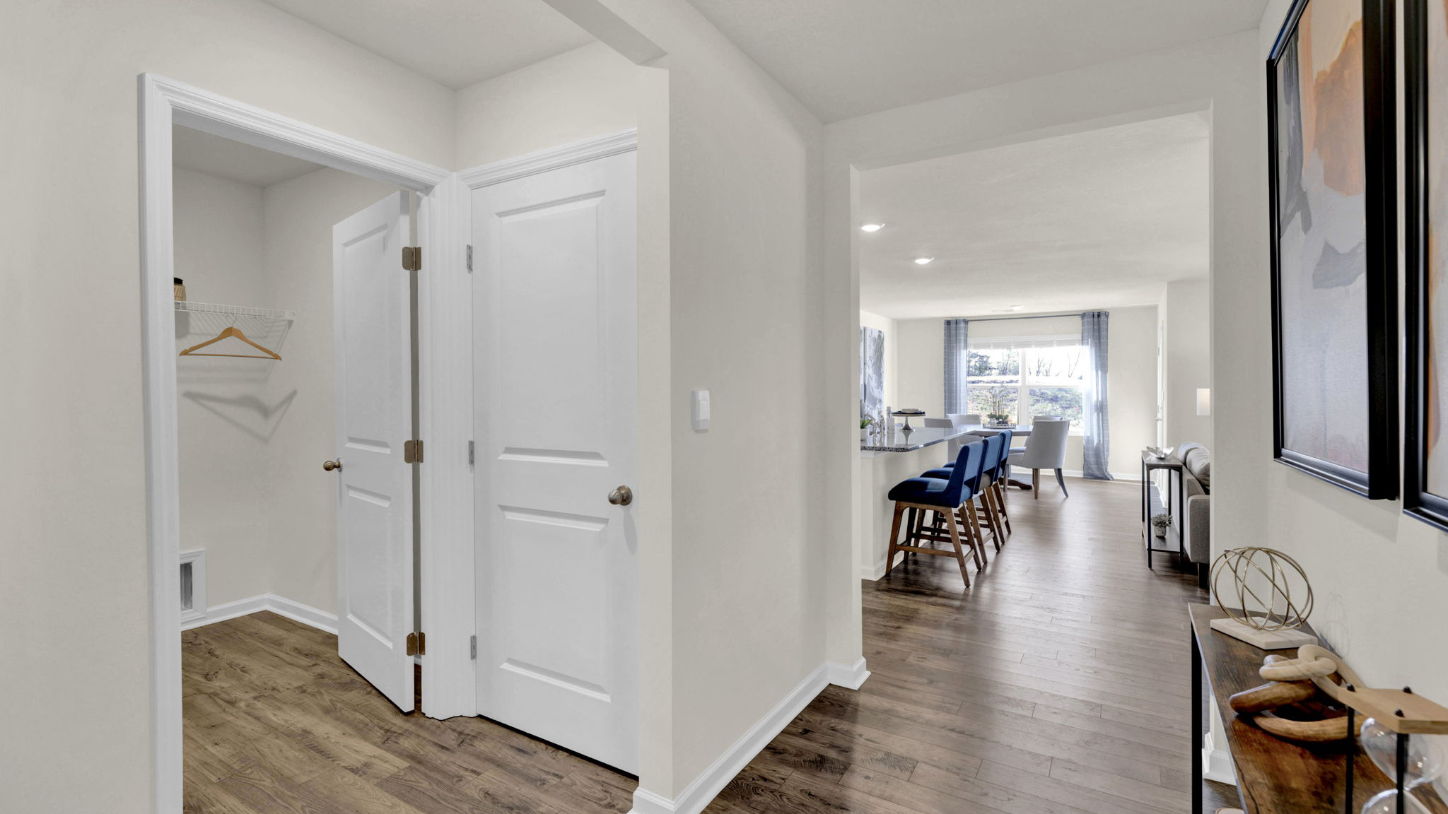 hallway with lvp opening to the living room