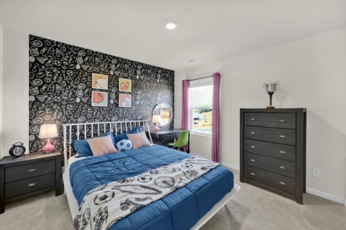 Guest bedroom with window and carpet
