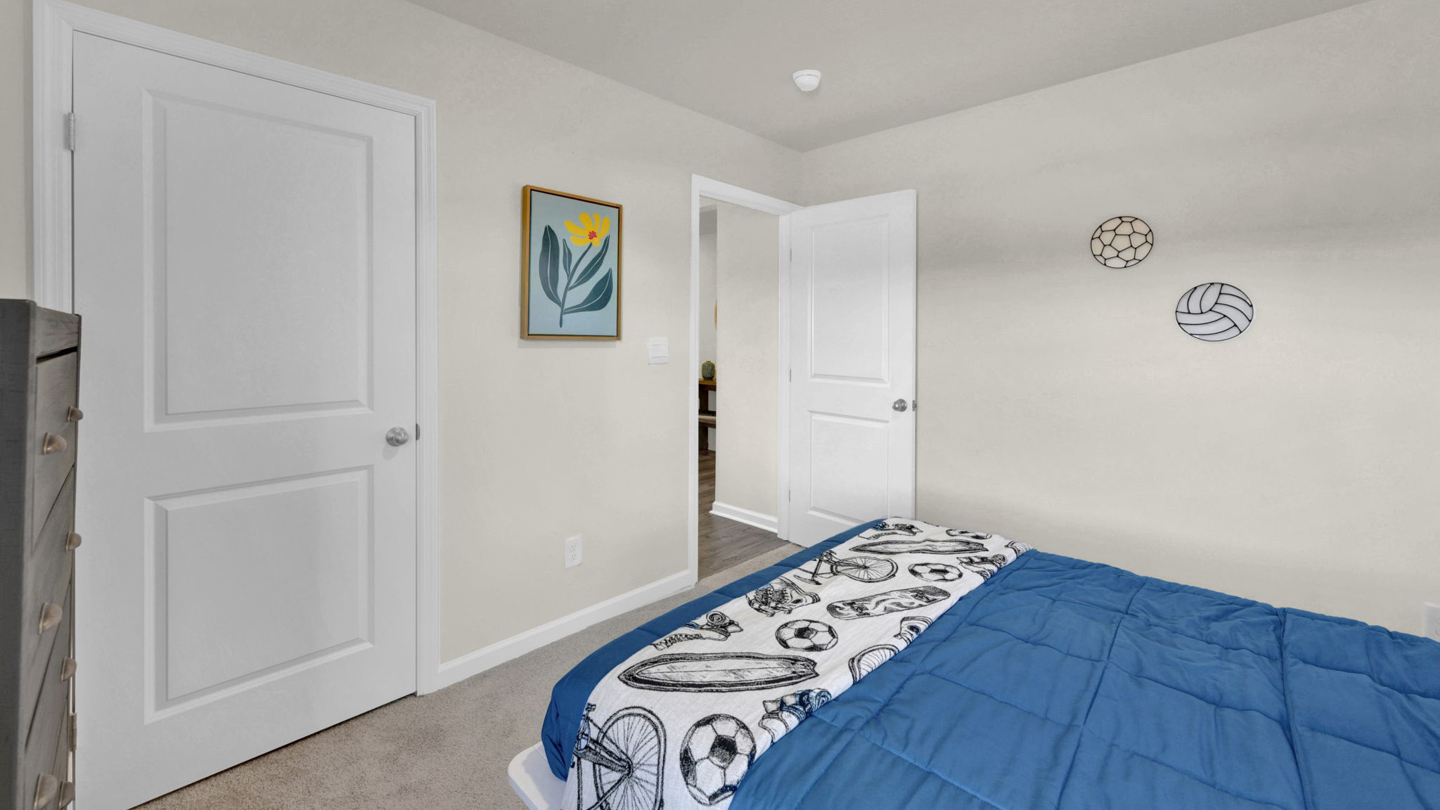 bedroom with bed facing the bedroom door