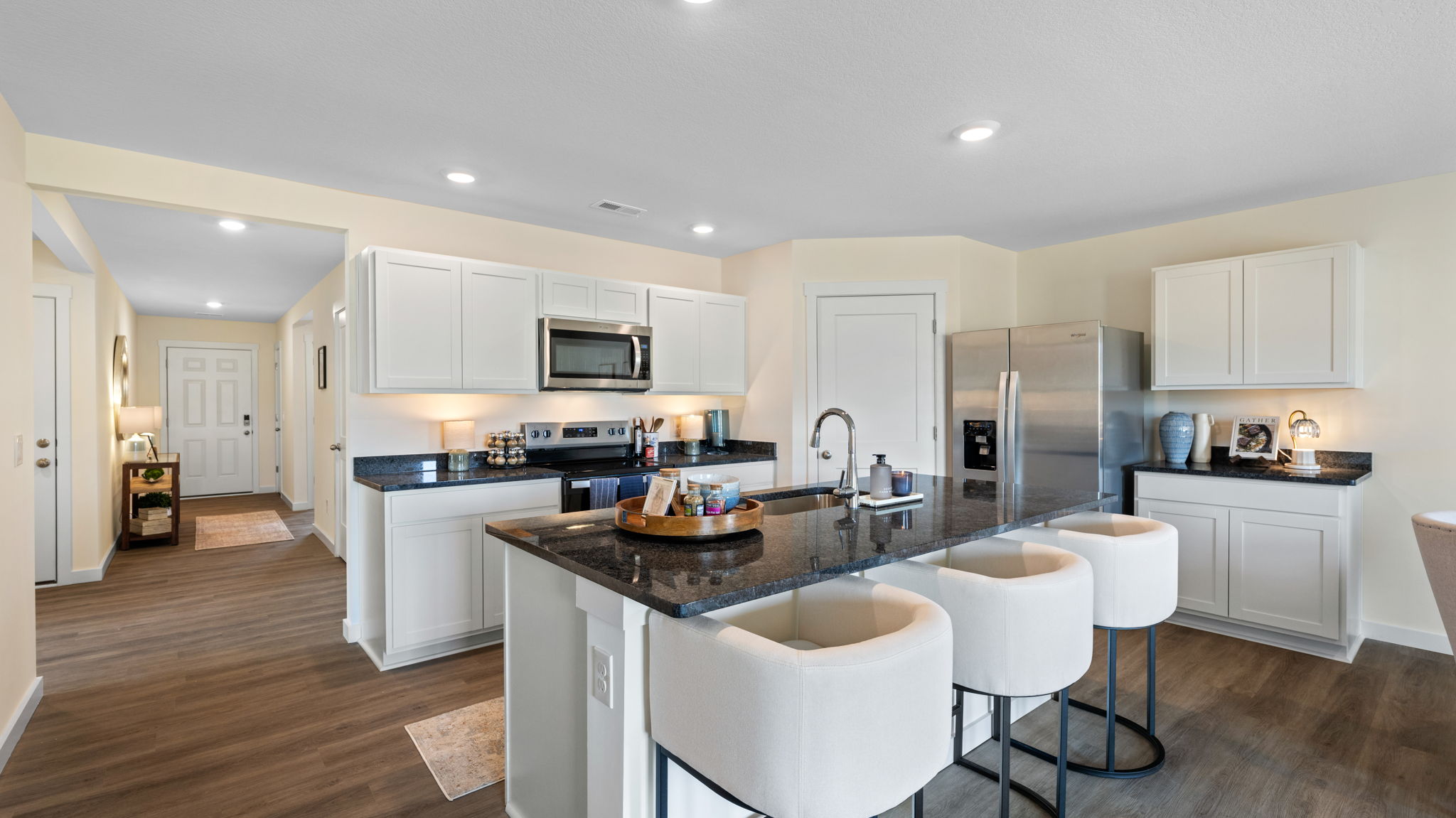 open concept kitchen with large island and stainless steel appliances