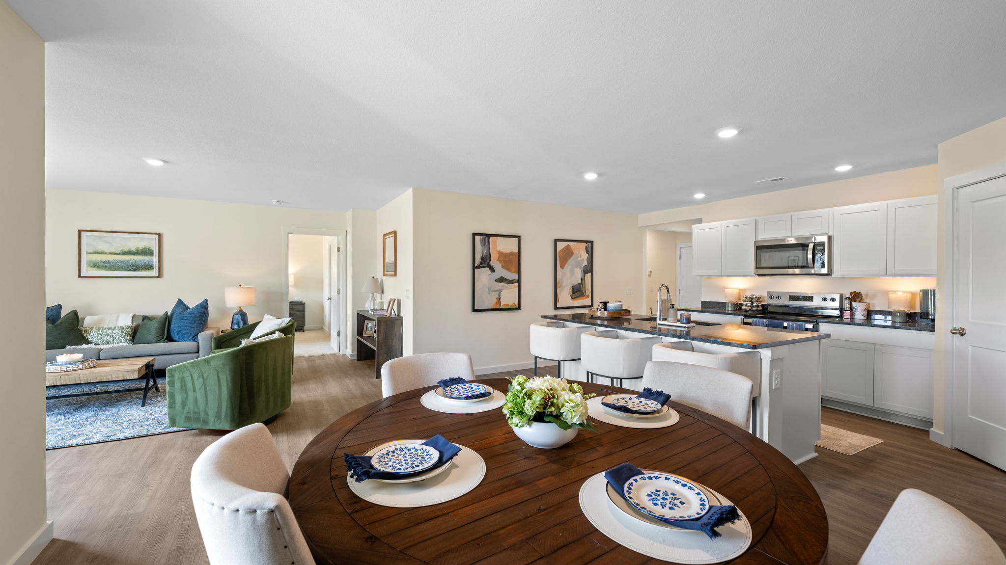 open concept kitchen with large island and stainless steel appliances