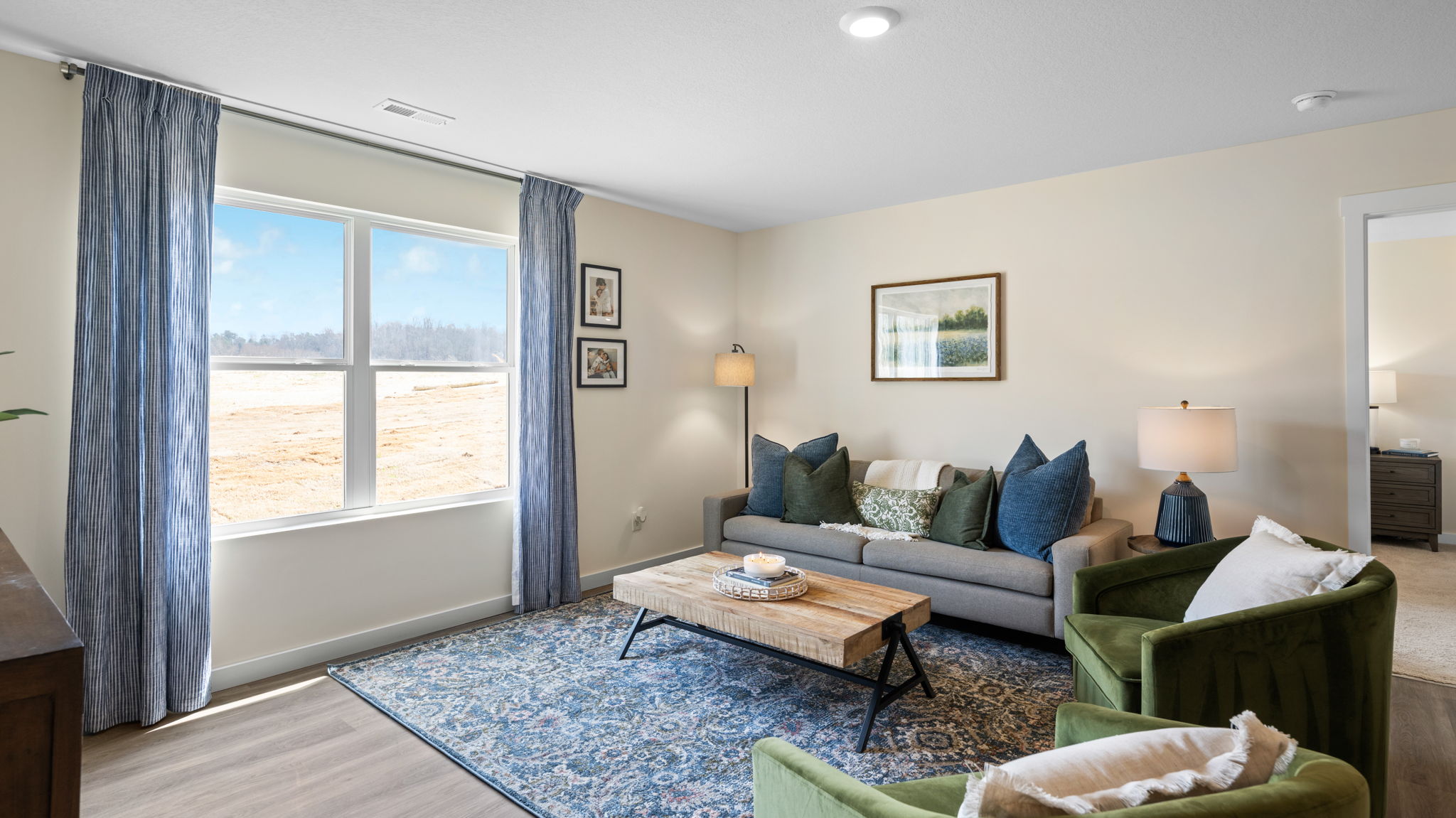 open concept living area with double window