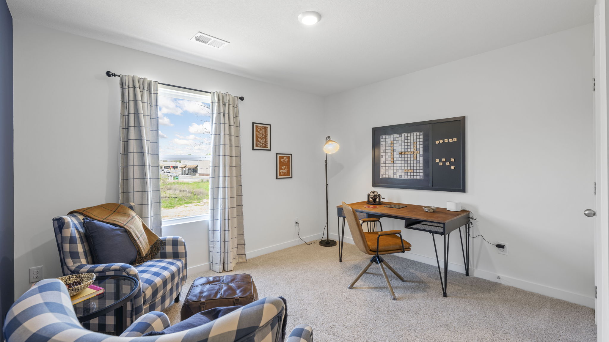 loft area with carpet and window