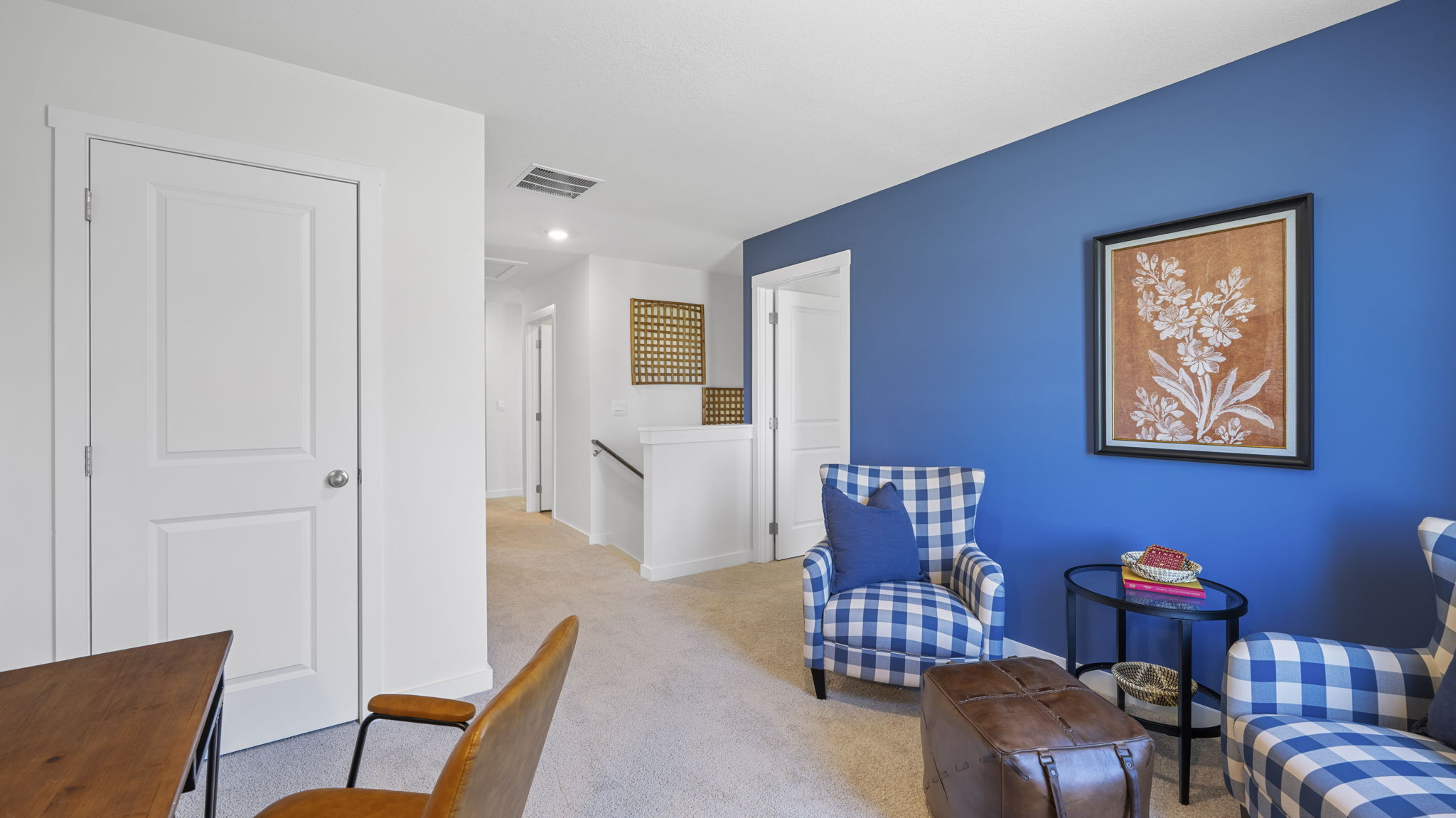 loft area with carpet and window