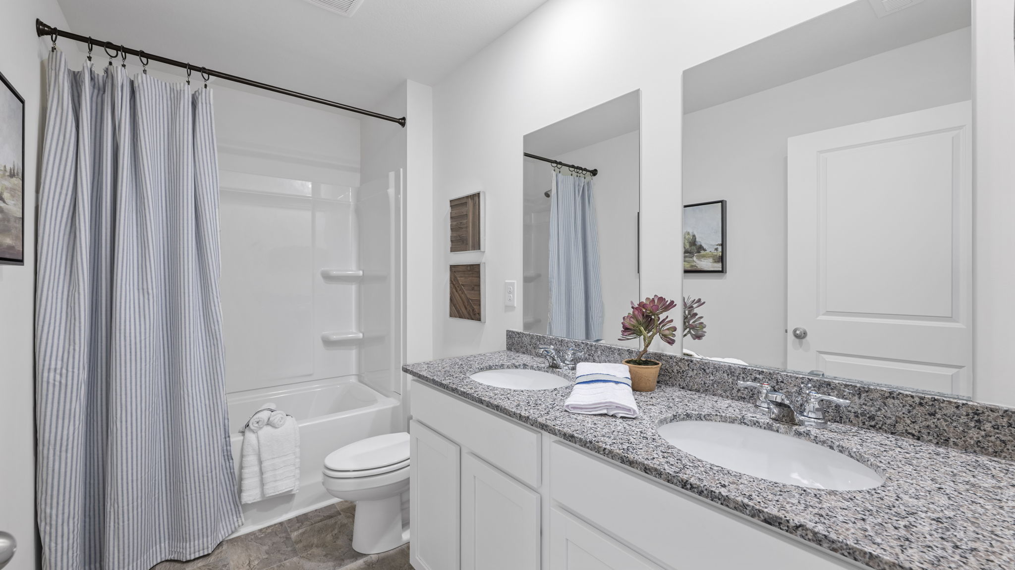 guest bathroom with double vanity