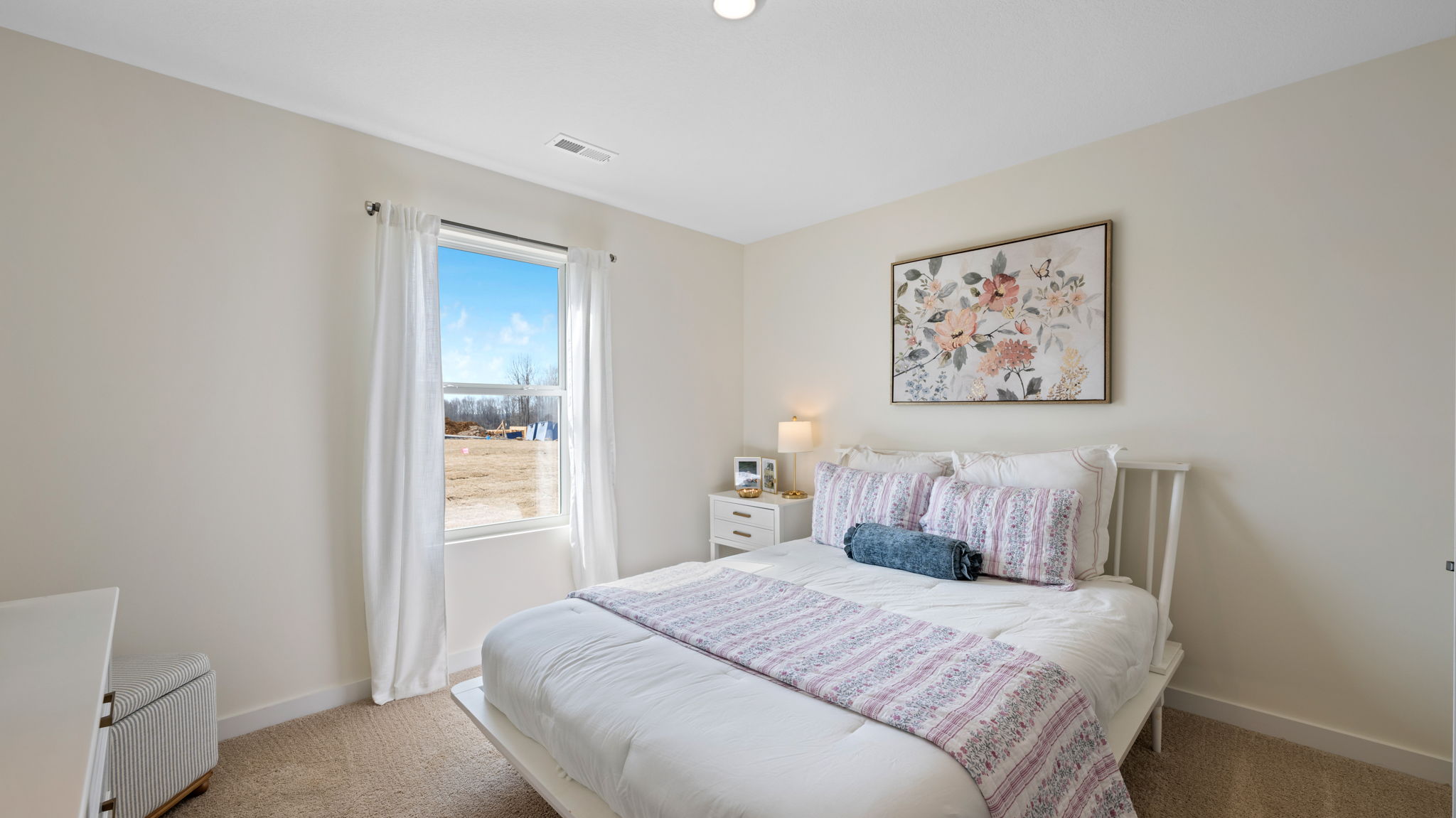 bedroom with single window and walk-in closet