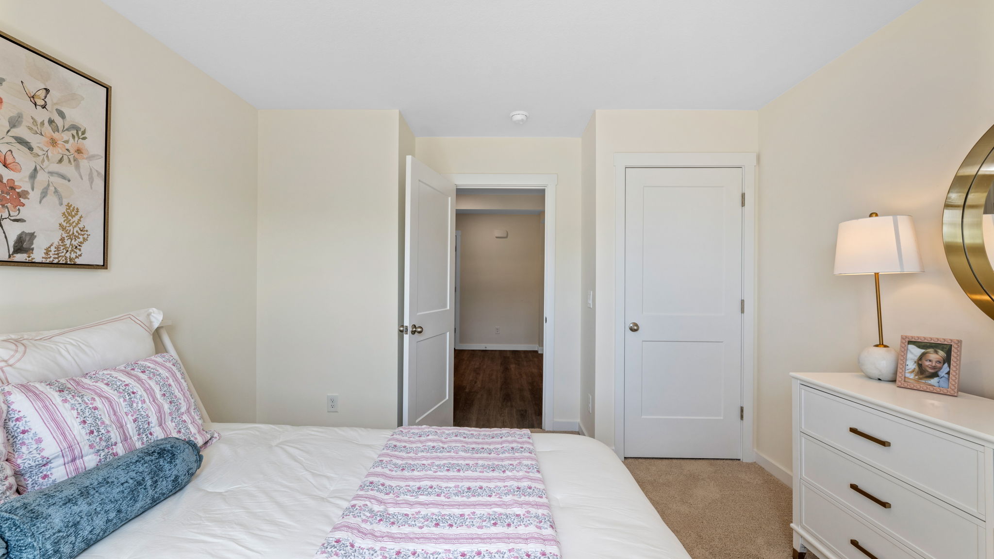 bedroom with single window and walk-in closet