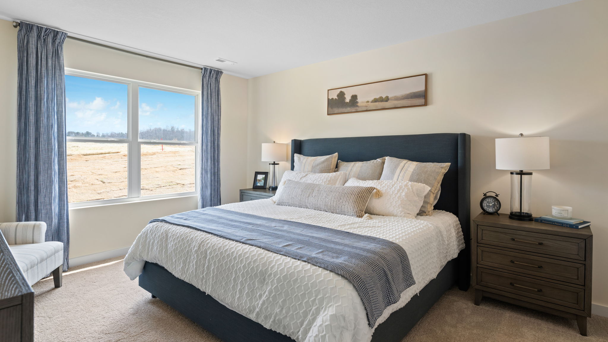 primary bedroom with double window and en suite