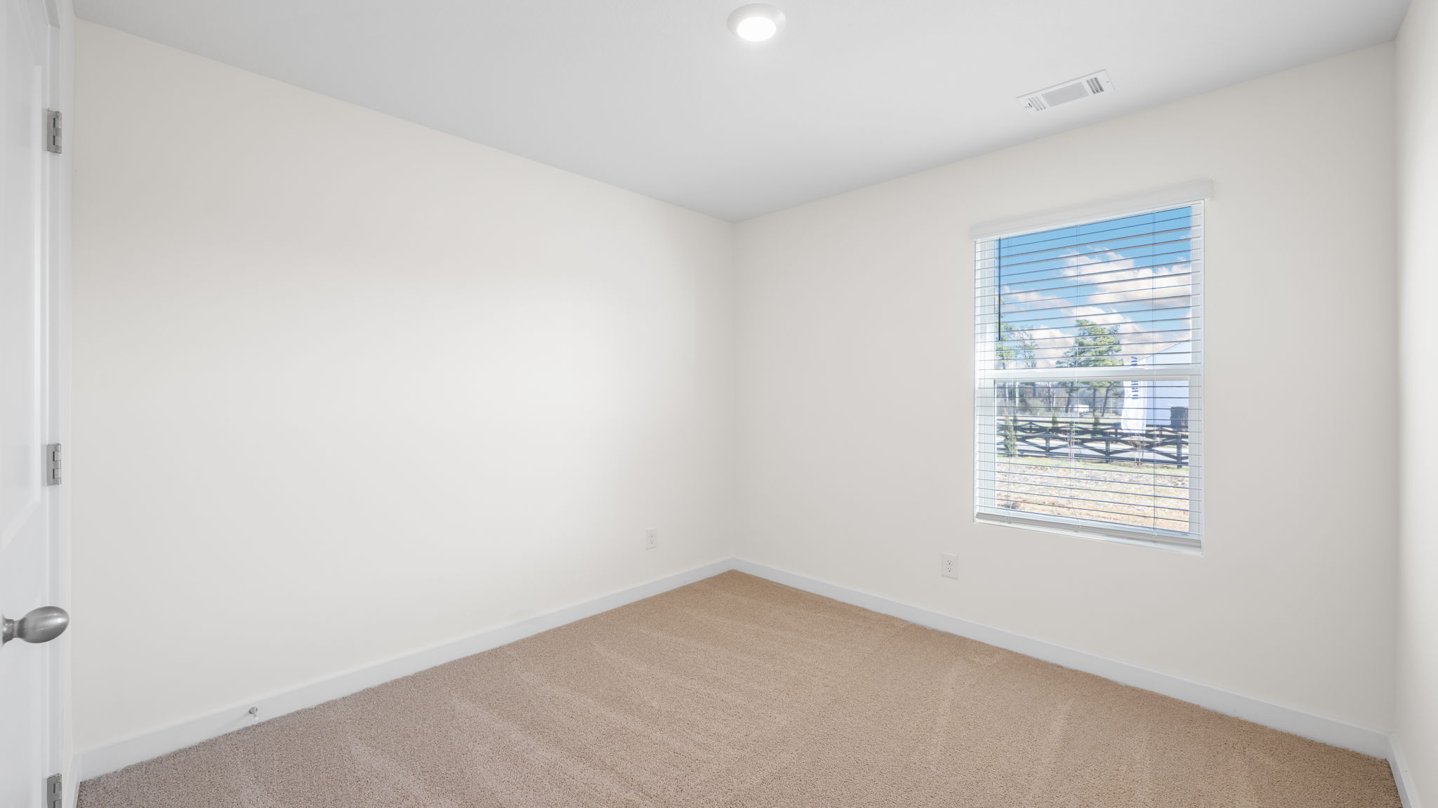 bedroom with single window and walk-in closet