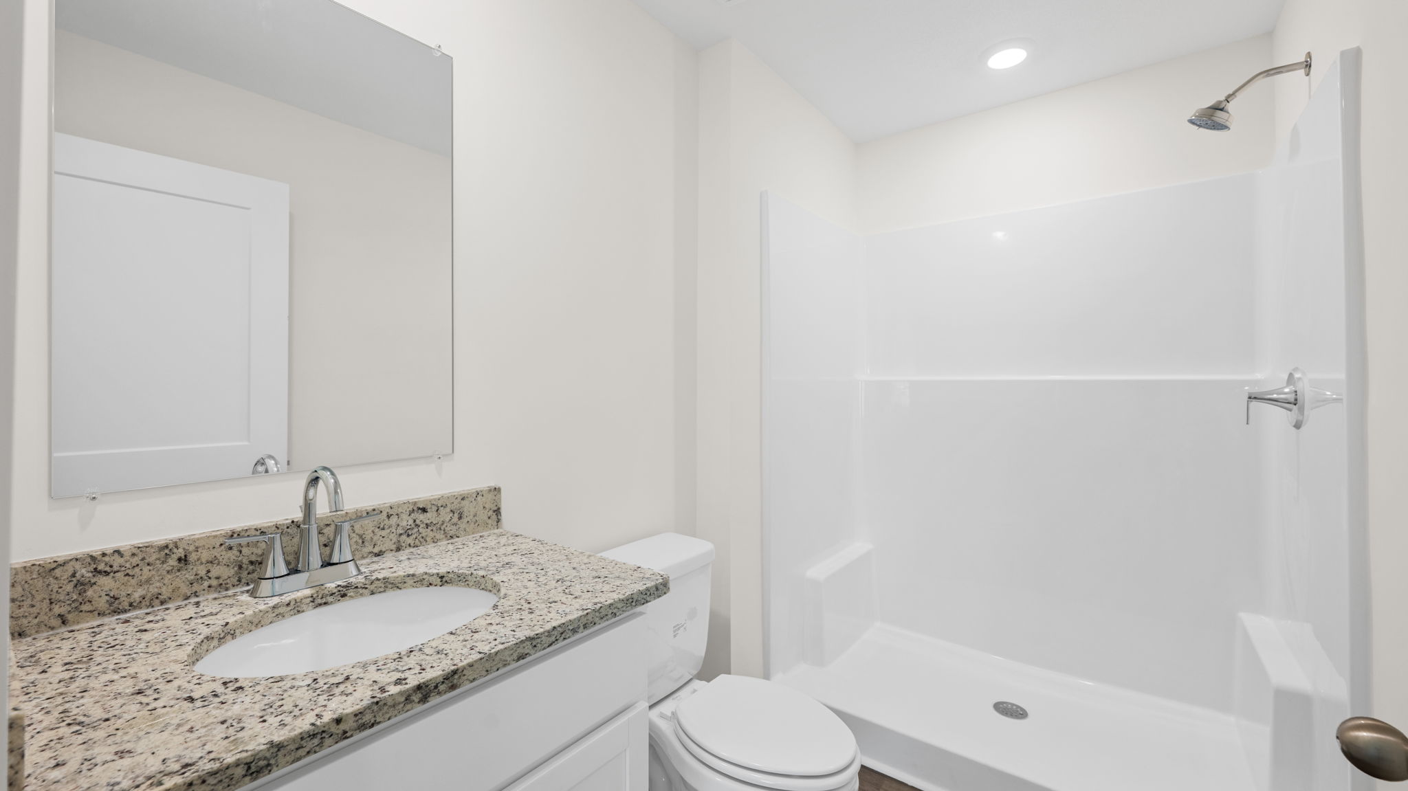 bathroom with single vanity and shower/ tub duo