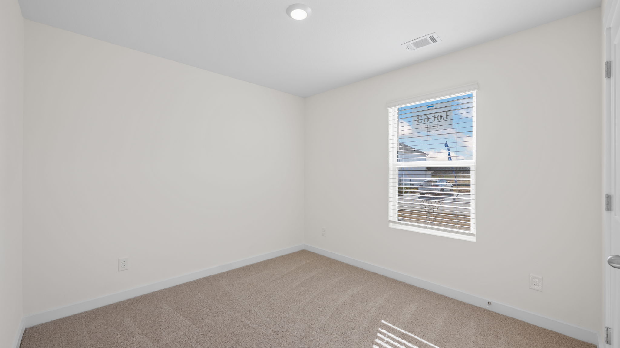 bedroom with single window and walk-in closet