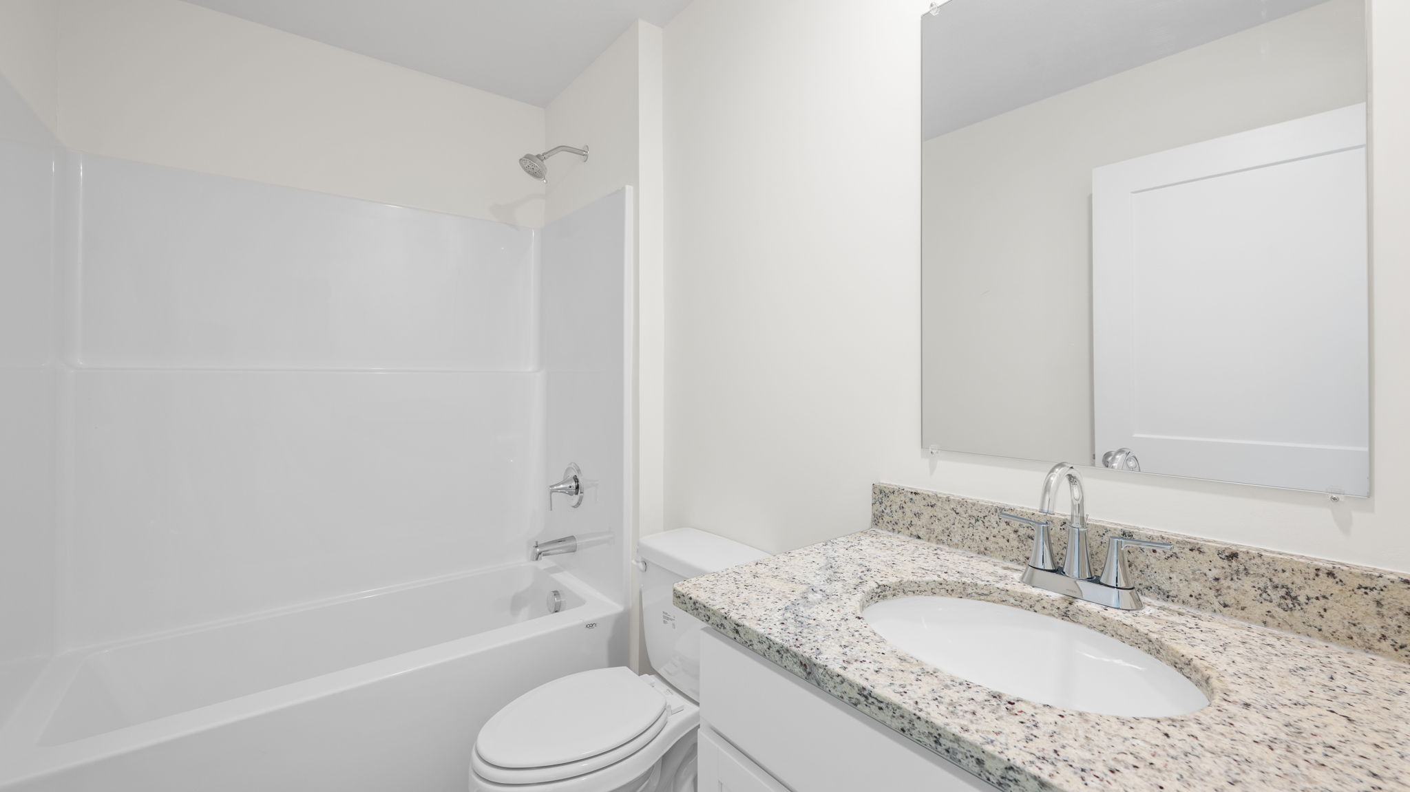 bathroom with single vanity and shower/ tub duo