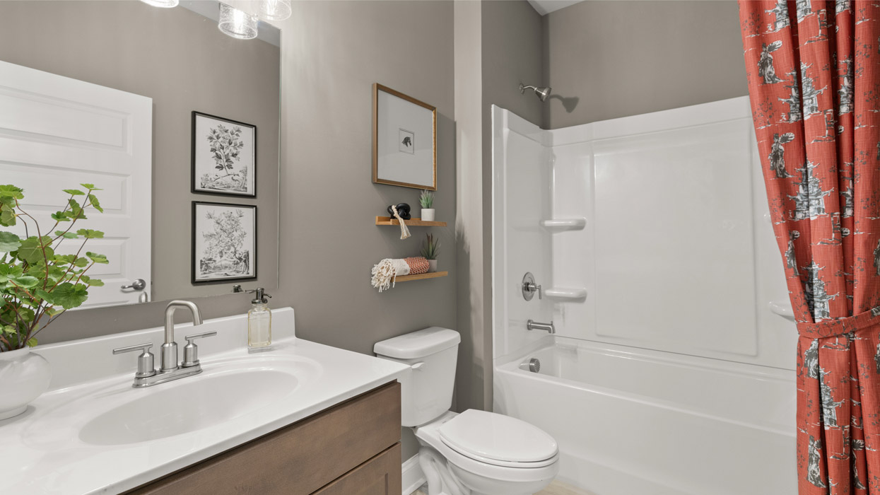 bathroom with bathtub and shower