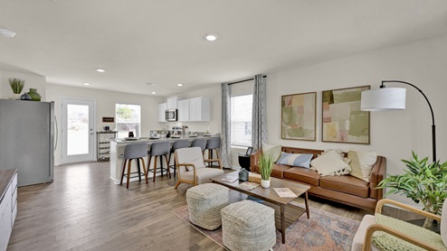 Open concept kitchen and living space with countertop seating