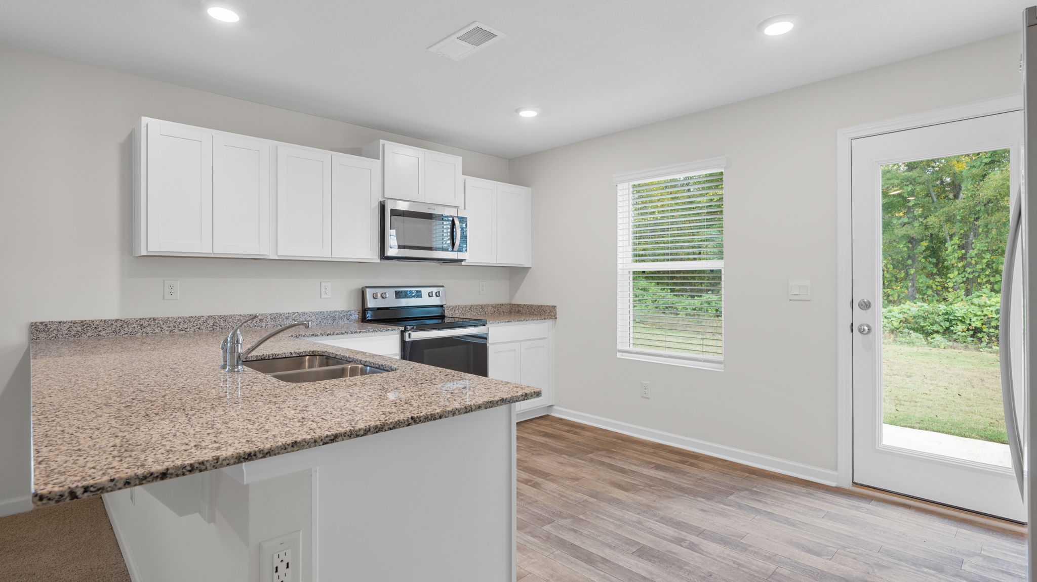 kitchen with island and white cabinets