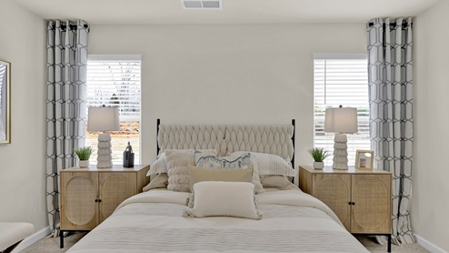 Primary bedroom with large windows