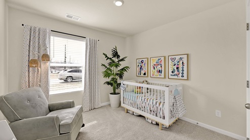 Bedroom staged as a nursery