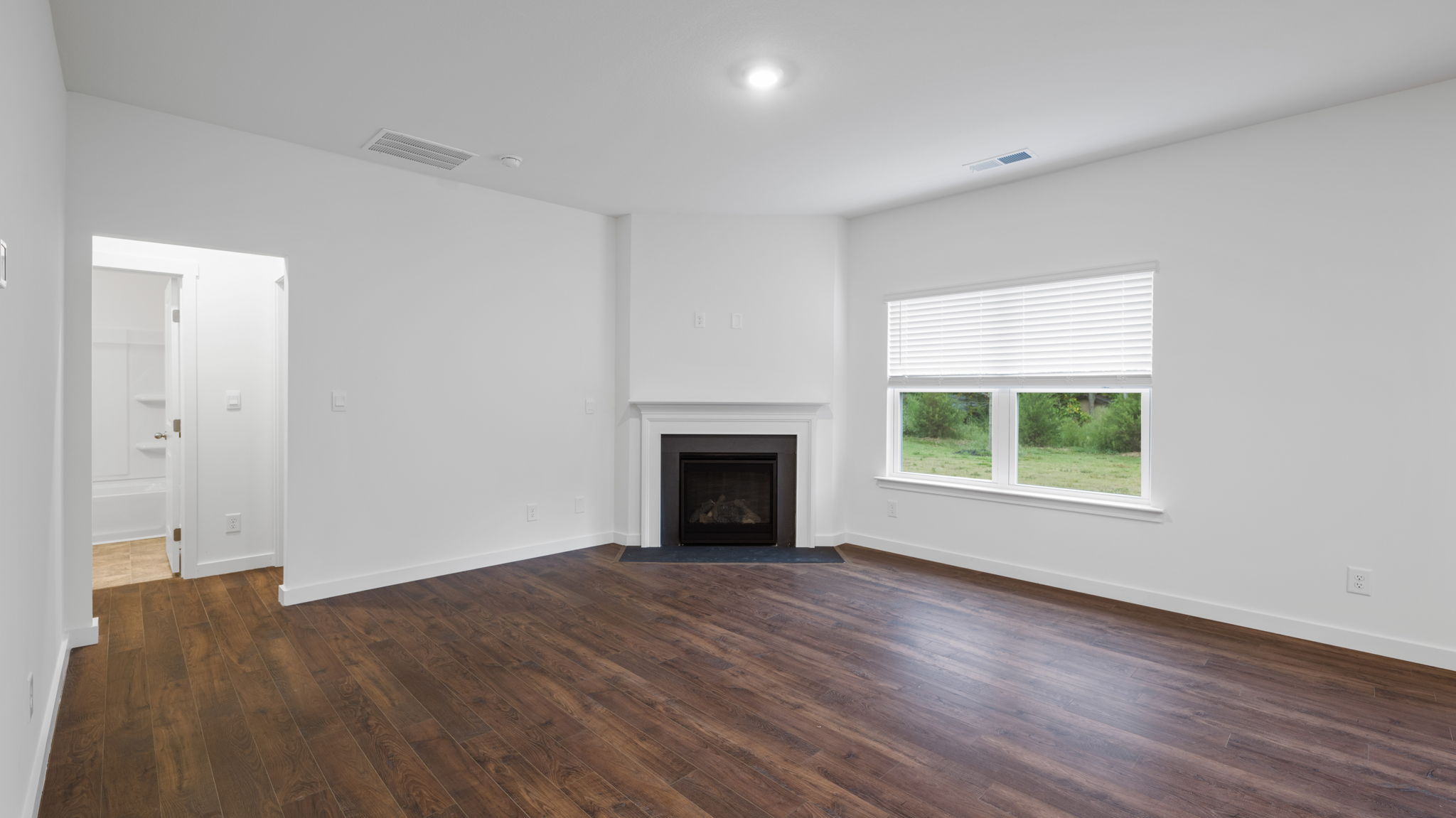 open concept living room with double window