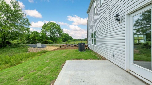 Concrete patio off back of house