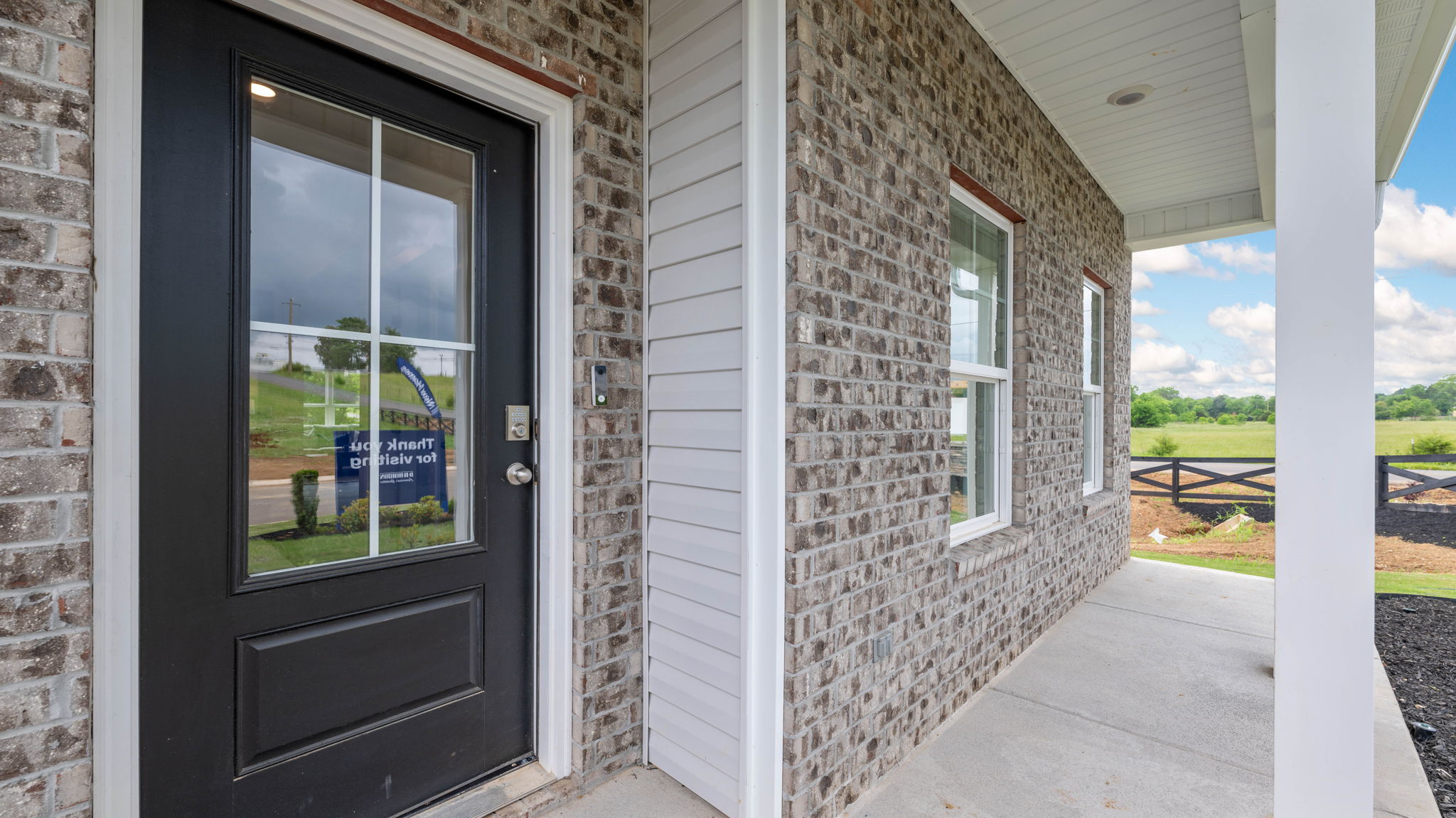 the porch has a column and door