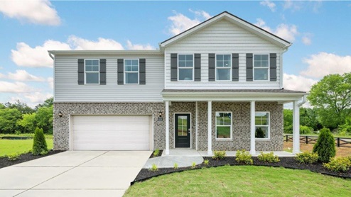 Two story home with two car garage and brick