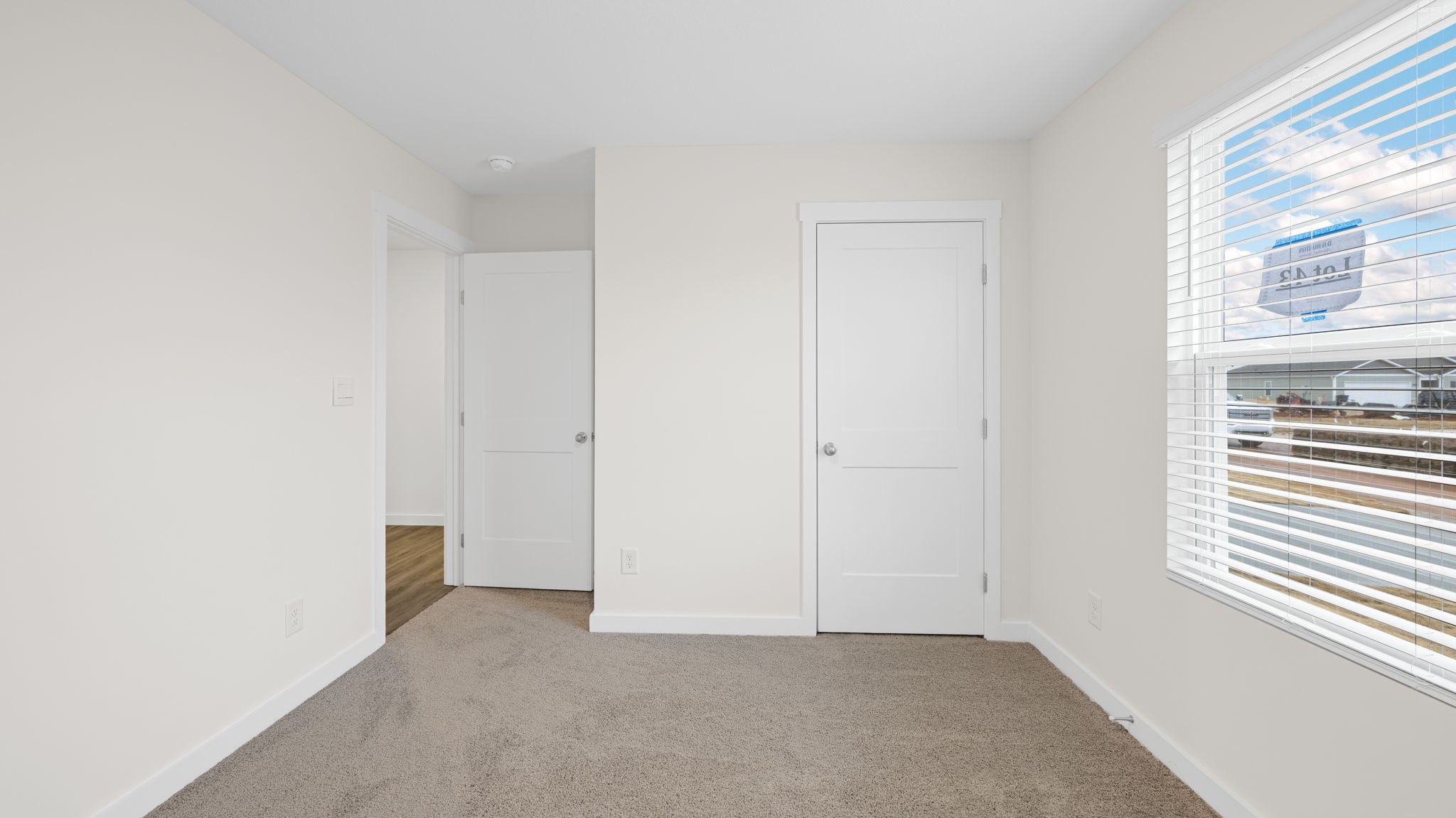 bedroom with single window and walk-in closetv