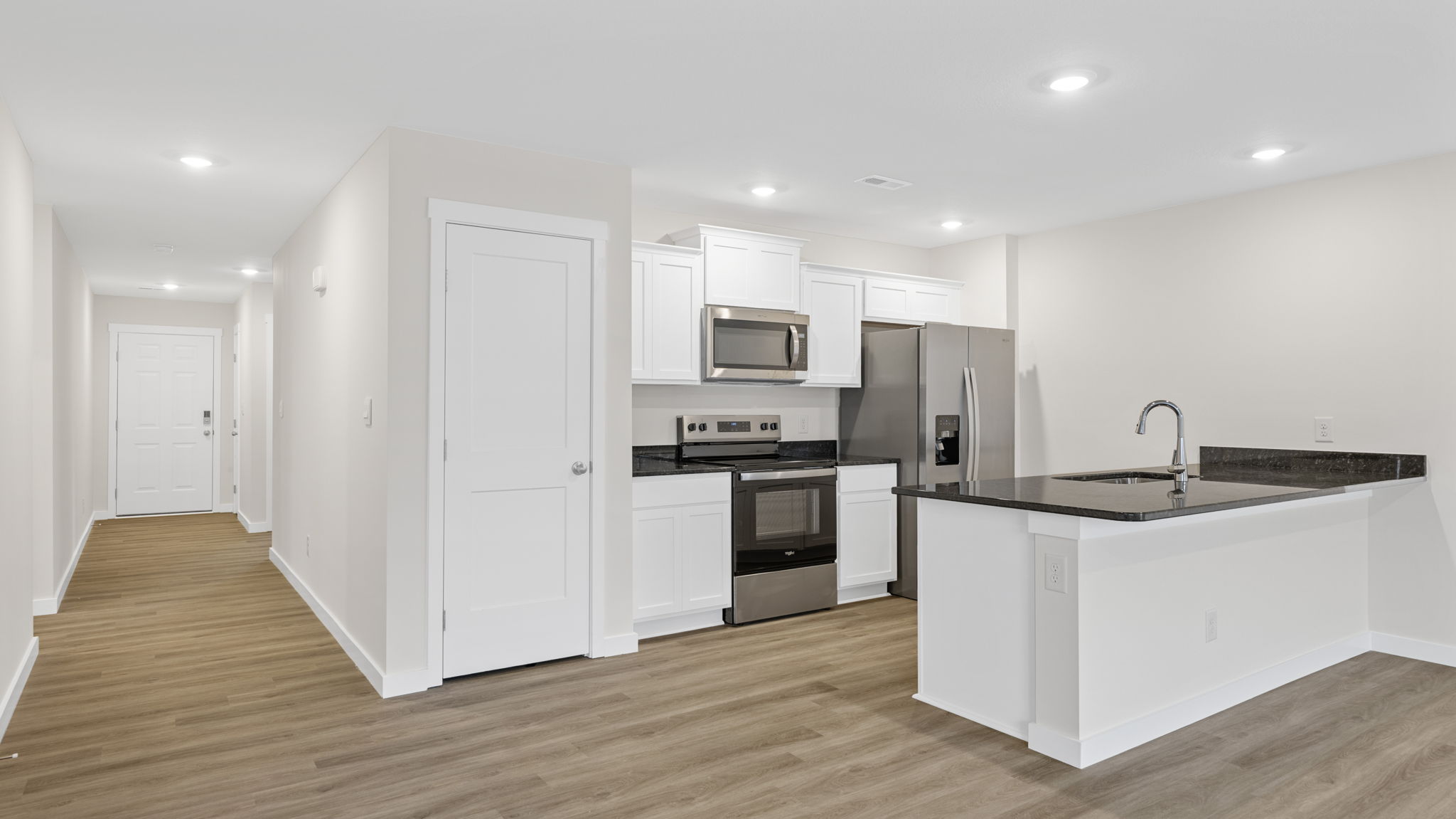 open concept kitchen with stainless steel appliances