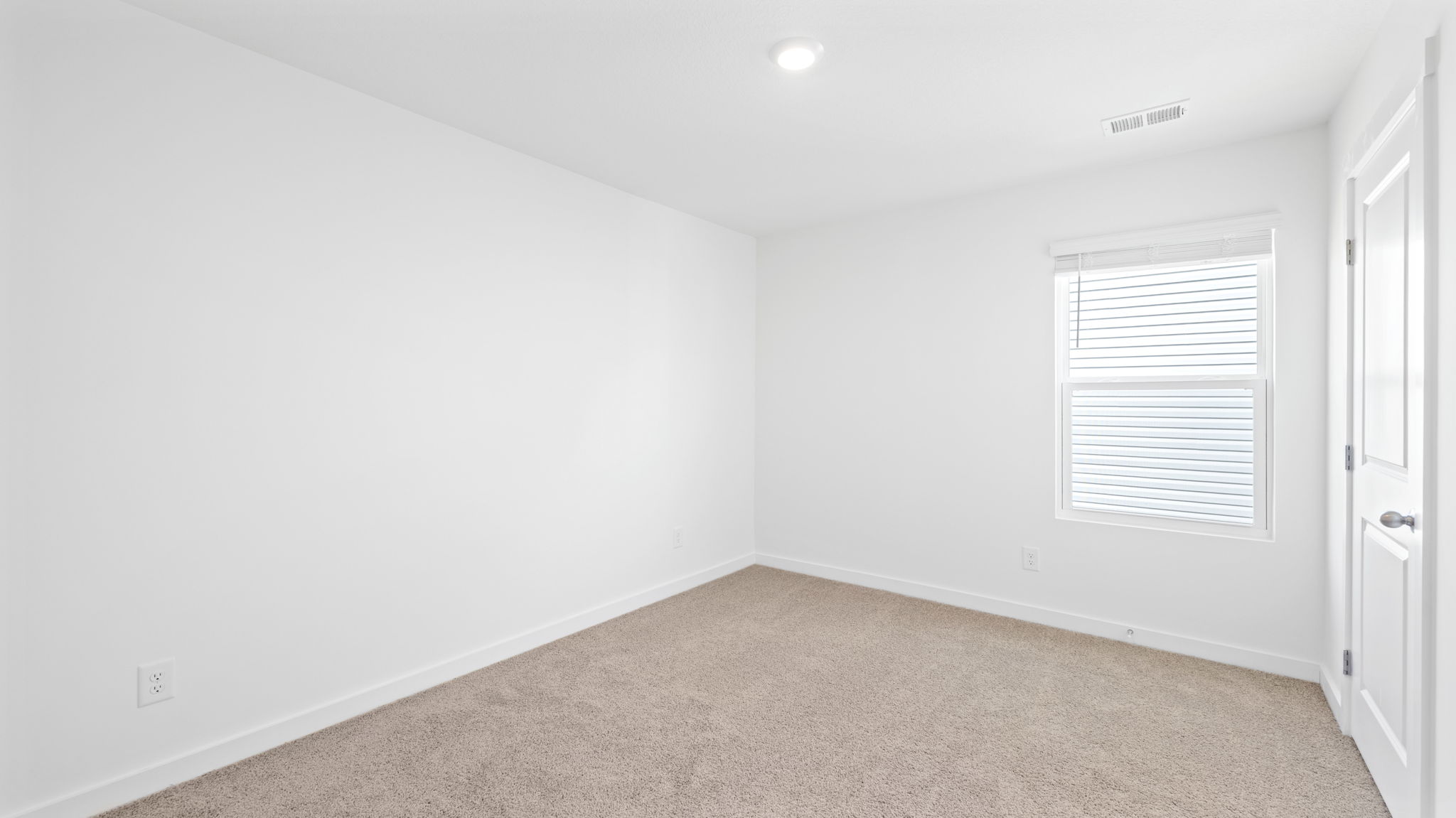 bedroom with single window and walk-in closet