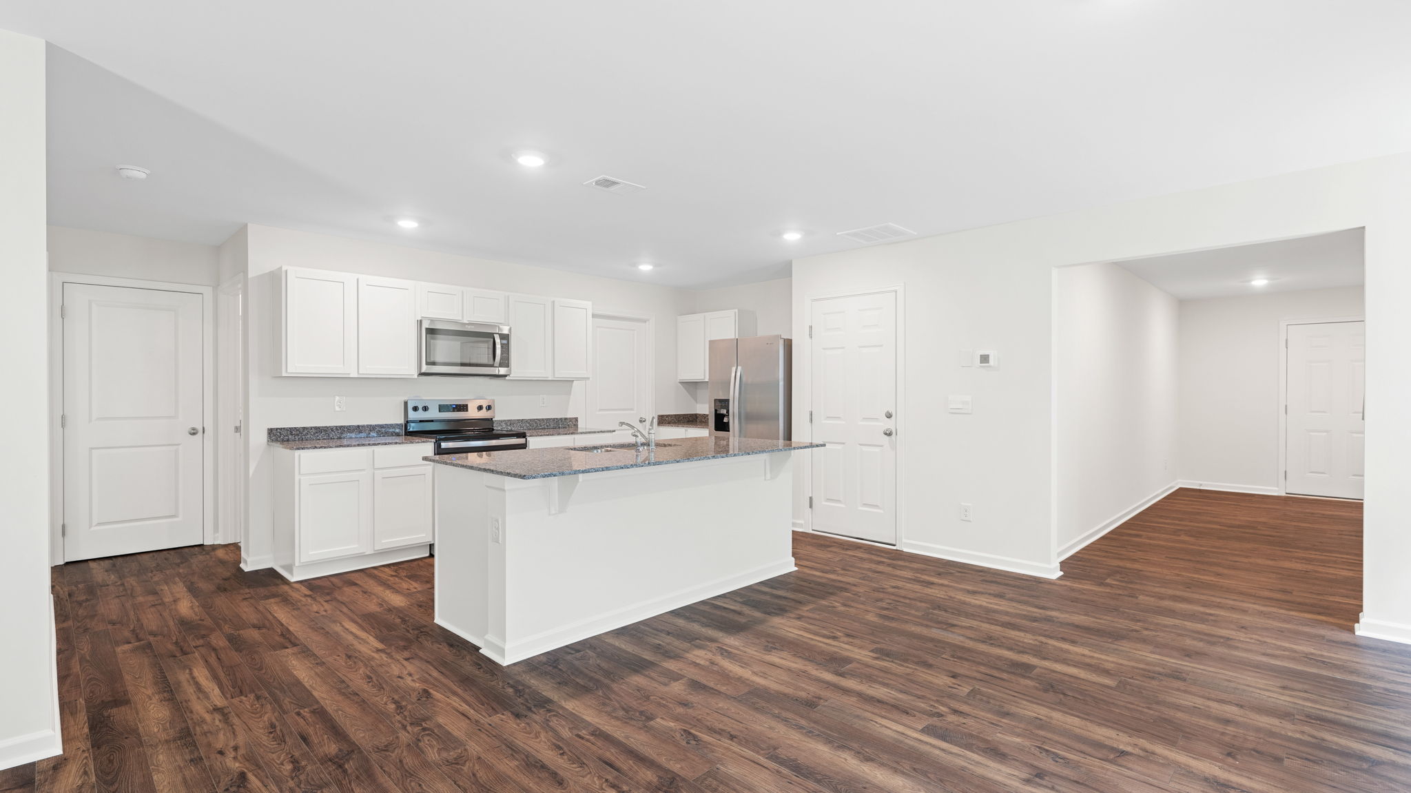 kitchen with island appliances and cabinets