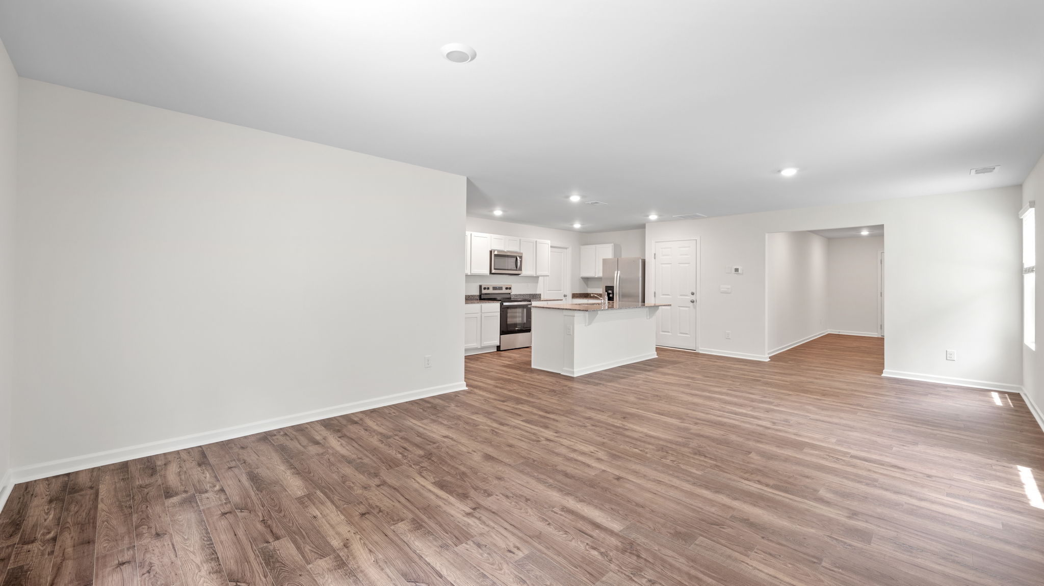 great room opens into the kitchen