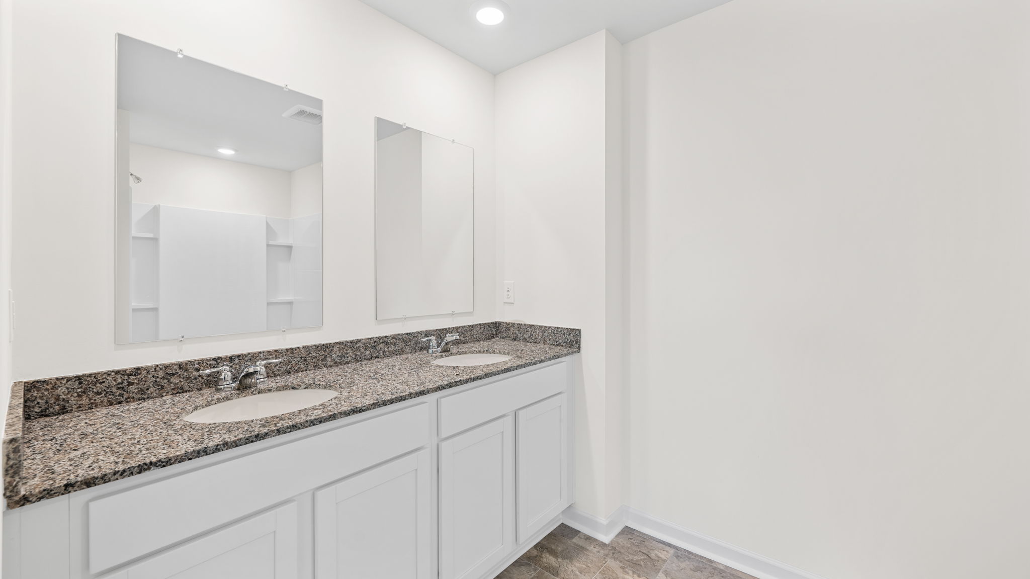 bathroom cabinets with solid countertops and mirrors